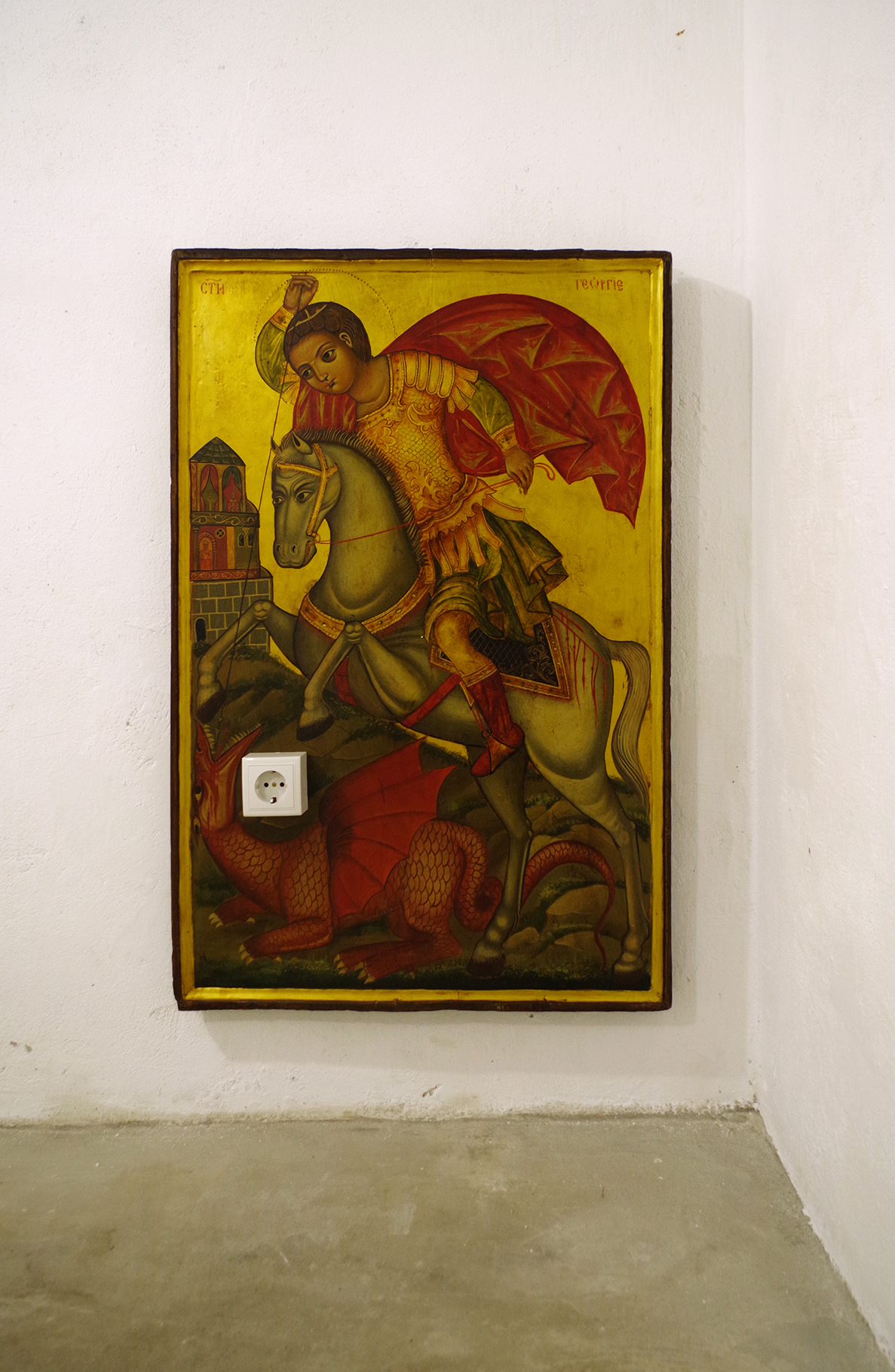 Saint George, 2018. Icon, plug, 60/91/10 cm. Installation view, Baba Vasa’s Cellar.