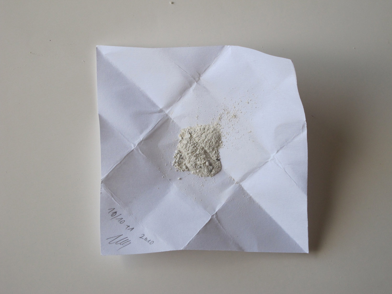 DAN, DAN, 2010. Five paper bags: 1 cm x 3 cm, white powder, plastic bag.