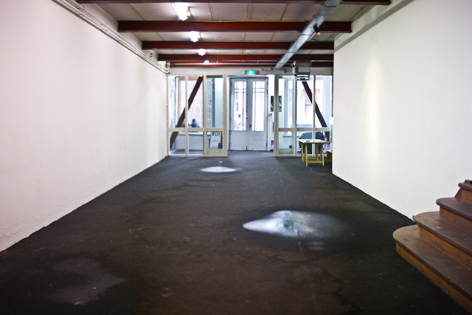 This is Not a Work, 2011. Pipes, dripping water, puddles. Installation view W139, Amsterdam.