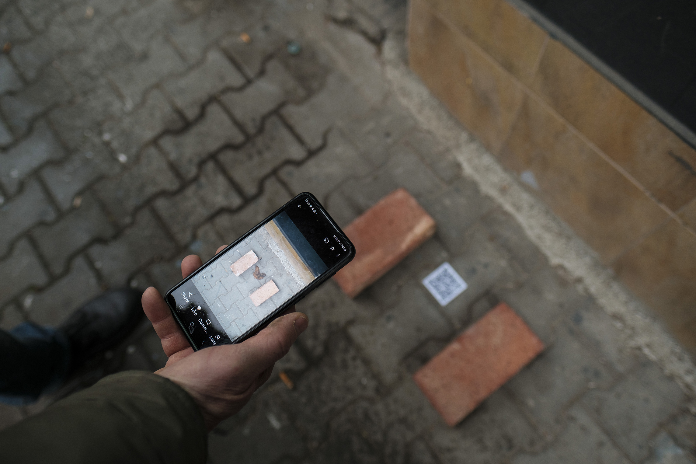 Reality and Illusion in the Ordinary, 2024. Two bricks, QR Code, installation view, the sidewalk in front of Punta Gallery, Sofia. Photo: Mihail Novakov