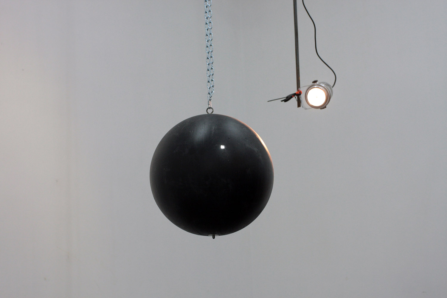 Untitled, 2010. Installation. Ball, mirror, chain, motor, spot light, reflection.